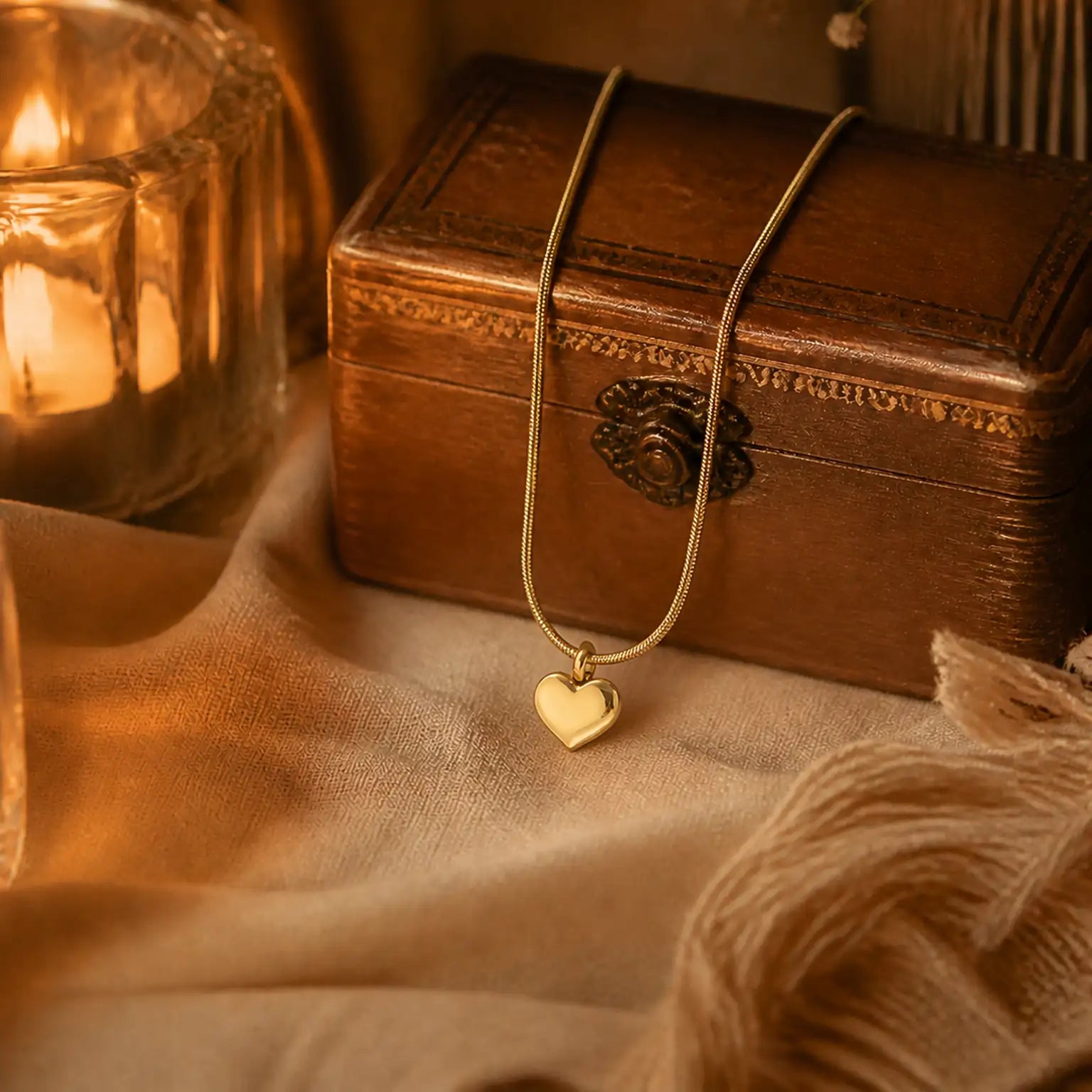 Anti-tarnish gold stainless steel smooth chain necklace with a polished gold heart pendant.