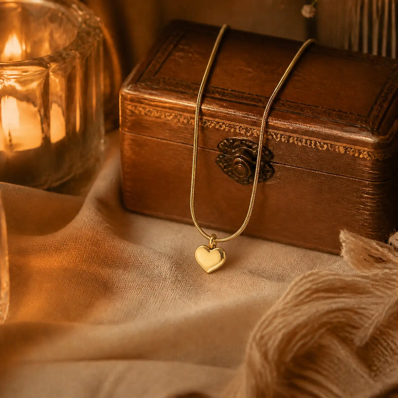 Anti-tarnish gold stainless steel smooth chain necklace with a polished gold heart pendant.