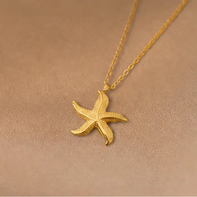 Anti-tarnish gold stainless steel chain necklace with a textured starfish pendant.