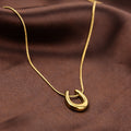 Golden Horseshoe Pendant Necklace
