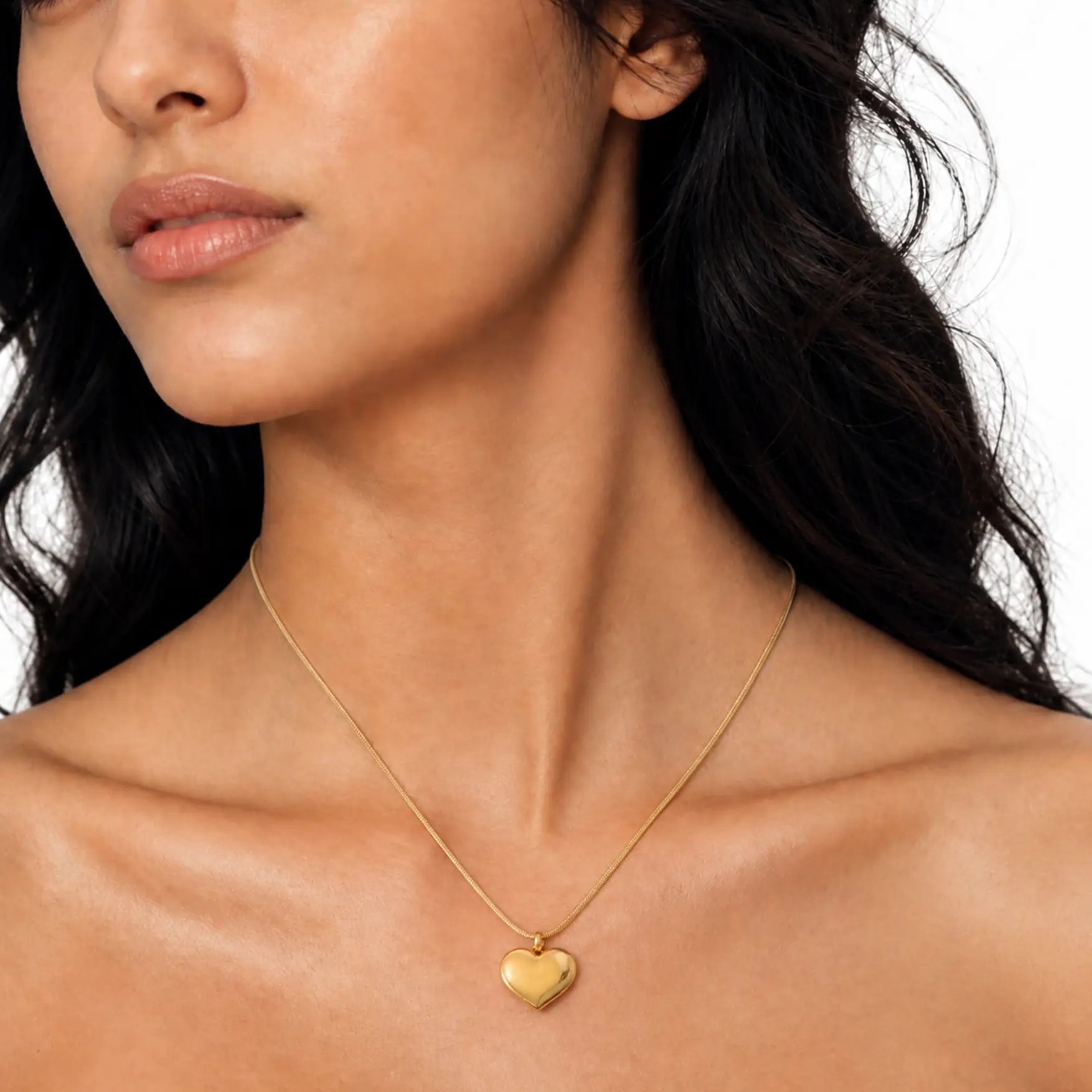 Anti-tarnish gold stainless steel smooth chain necklace with a polished gold heart pendant.