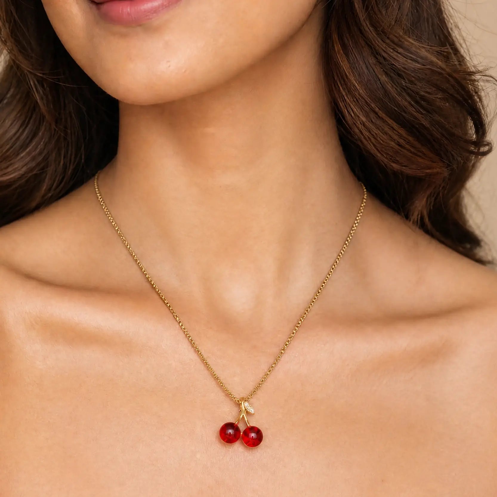 Anti-tarnish gold stainless steel box chain necklace with a red crystal cherry pendant.