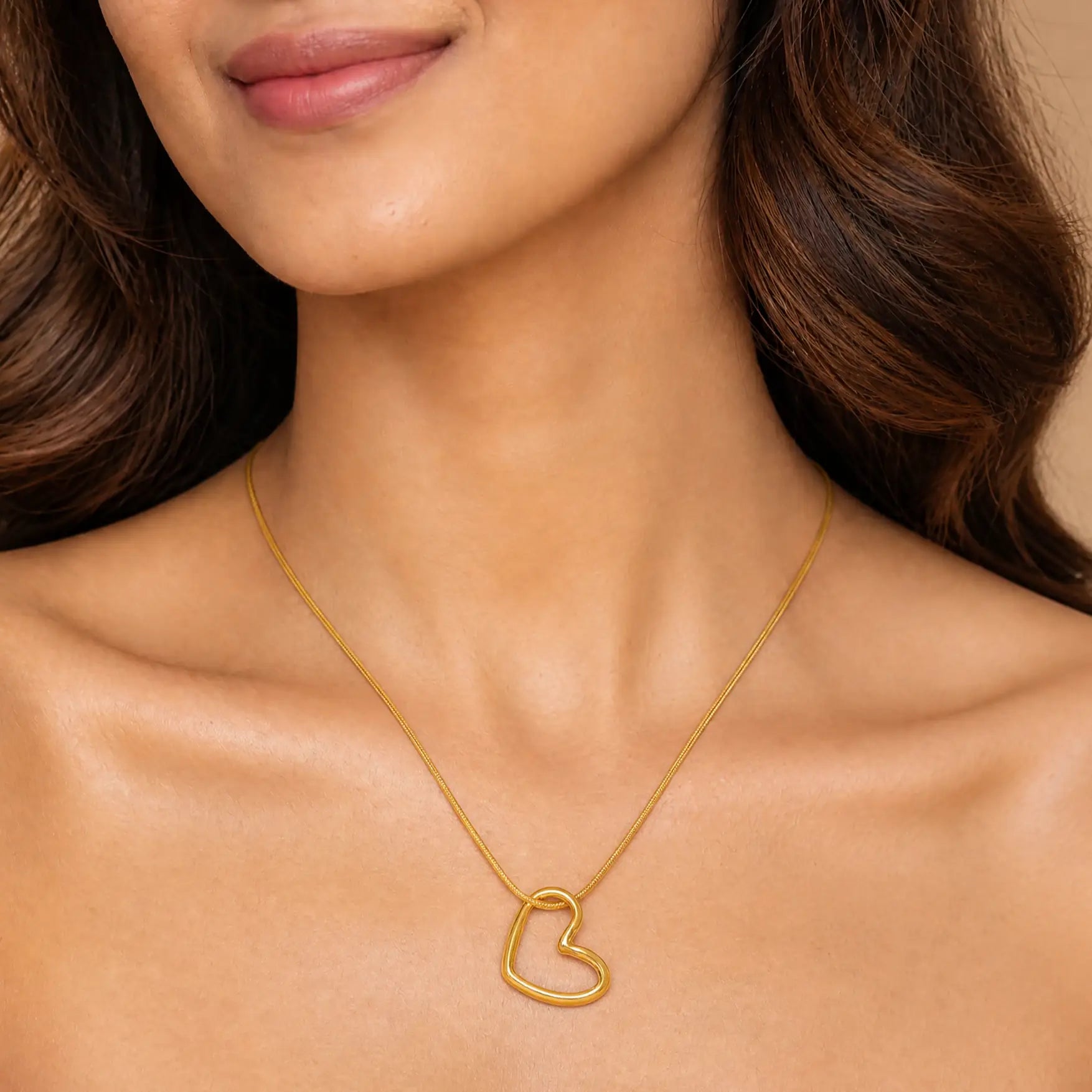Anti-tarnish stainless steel open heart pendant necklace surrounded by white flower petals.